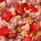 Close-up of a fresh fruit and granola mixture, ideal for a healthy breakfast or snack option.