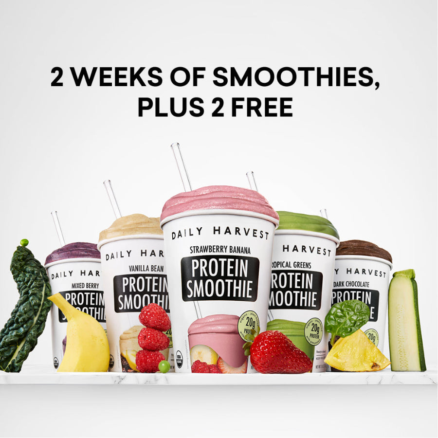 Daily Harvest protein smoothie containers with fruits and vegetables on a white background