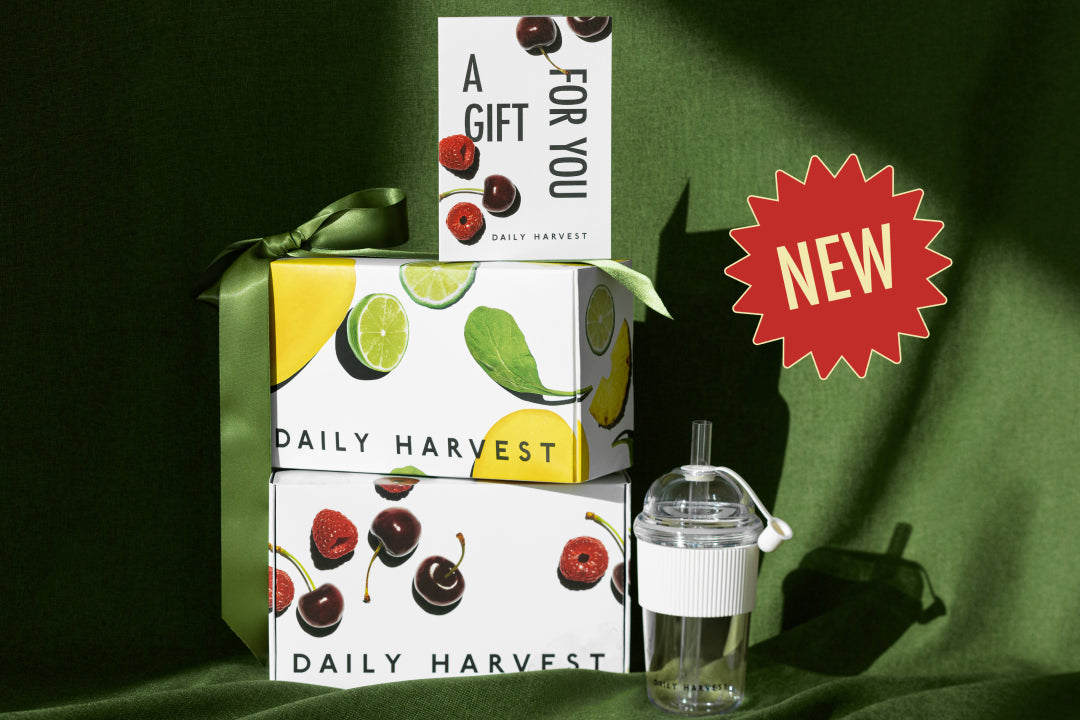 Phone displaying a gift card on a green fabric background