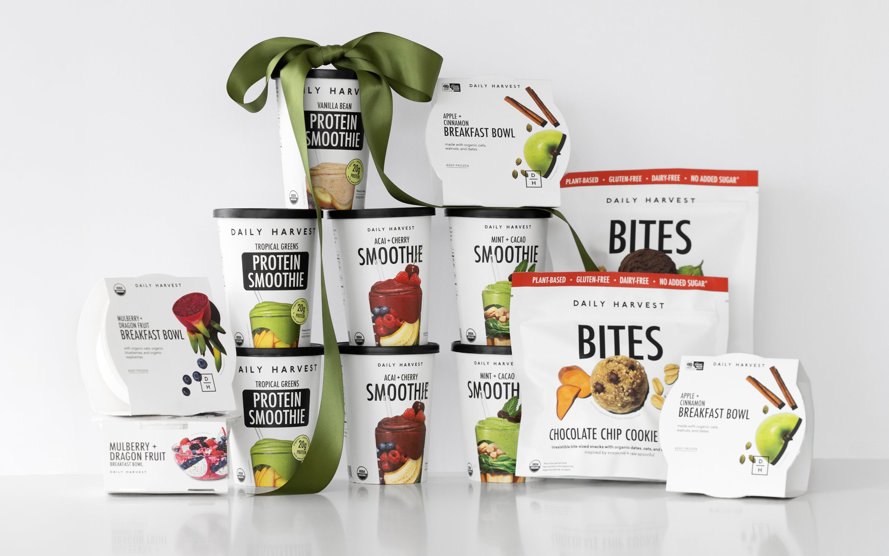 Daily Harvest smoothies, bites, harvest bowl with a green ribbon.