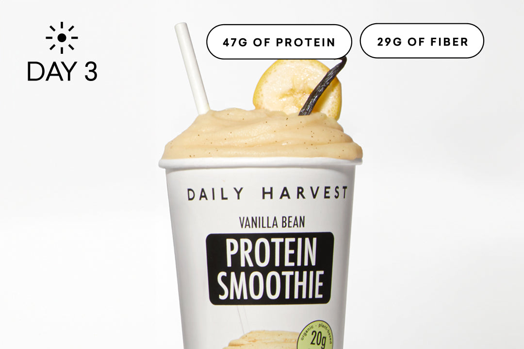 Pink smoothie with strawberries and a lemon wedge, featuring 'Daily Harvest' branding. 47G of Protein. 29G of Fiber.