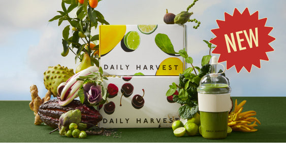 Daily Harvest box with fresh produce and a green smoothie on a table. New!