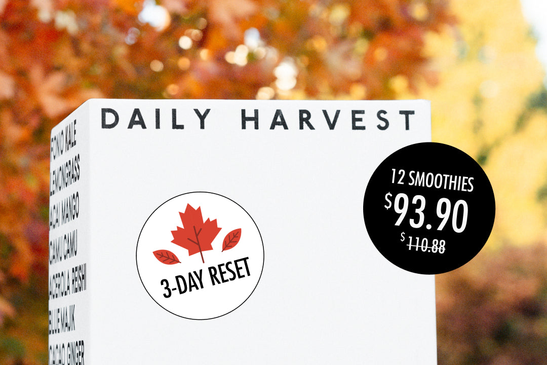 Daily Harvest smoothie box with autumn leaves in the background