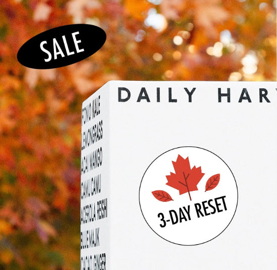 Box labeled 'Daily Harvest' with '3-Day Reset' on a blurred autumn leaf background.