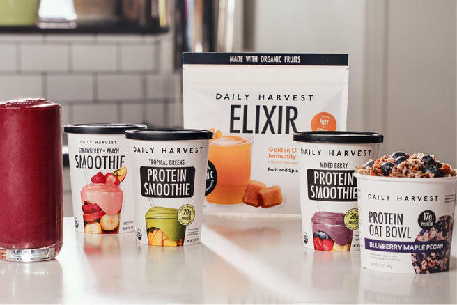 Daily Harvest smoothie and oat bowl products on a kitchen counter.