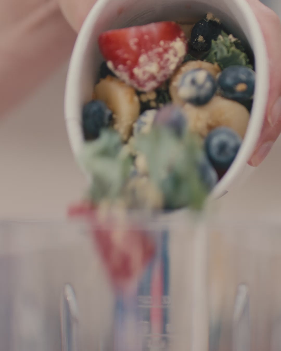 Daily harvest smoothie poured into a blender.