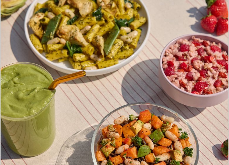 Daily Harvest pasta, smoothie and oat bowl on a table