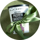 Smoothie wrapped in a green ribbon as a gift.