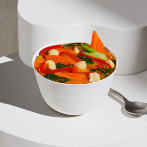 Image of Daily Harvest Carrot + Coconut Soup prepared in a bowl.